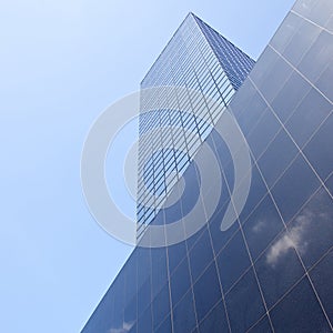 Cloud reflected in office building