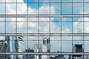 Cloud reflection in high glass offices. Blue reflection of the s