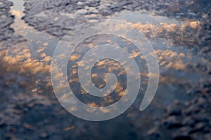 Cloud reflection in a puddle