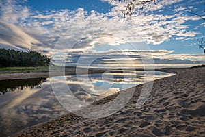 Cloud reflections on coastal lagoon