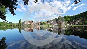 Cloud reflections in Dordogne River at Beaulieu sur Dordogne, Correze, Limousin