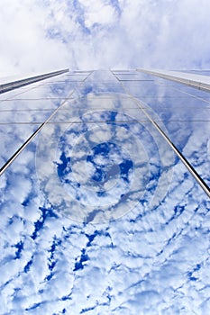 Cloud reflections on glass wall