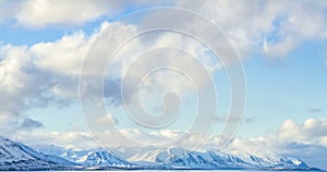 Cloud rolling time lapse over snow mountain fjords in Akureyri, Iceland.