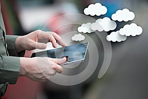 Cloud Services. Businessman holding a smart tablet, mobile cell, cars
