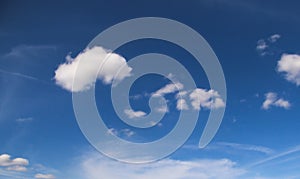 Cloud skies bright the turquoise blue.