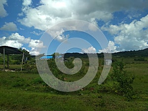 CLOUD SKY IN GREEN SAVANA HILL PAPUA INDONESIA