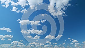 Cloud sky scape. Clouds flying and changing with different shapes on clear blue sky. Time lapse.