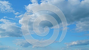 Cloud sky scape. Clouds flying and changing with different shapes on clear blue sky. Time lapse.