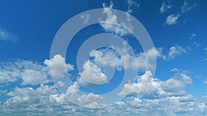 Cloud sky scape. Clouds flying and changing with different shapes on clear blue sky. Time lapse.