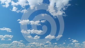 Cloud sky scape. Clouds flying and changing with different shapes on clear blue sky. Time lapse.