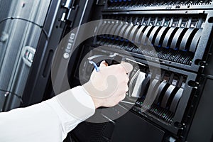 Cloud storage service. engineer replacing hard drive disk hdd in server