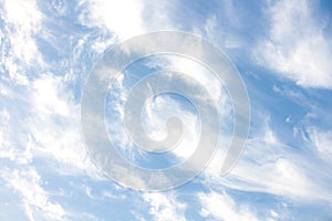 Cloud streaks and light blue sky