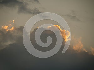 Cloud at sunset, red silver lining.