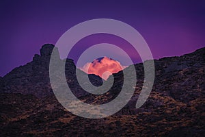 Cloud tip from behind the mountain