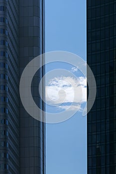 Cloud between two skyscrapers
