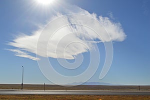 Cloud wisp over the middle of the Texas plain, nowhere, Texas