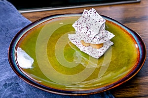 Cloudberry meringue. French cuisine. The work of a professional chef. Dish from a restaurant or cafe menu. Close-up