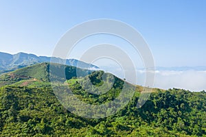 The clouds above the city seen at the green mountains , in Asia, Vietnam, Tonkin, Dien Bien Phu, in summer, on a sunny day