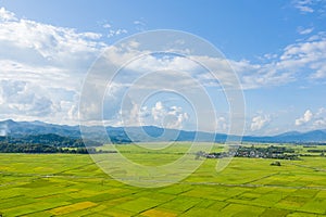 The clouds above the city seen at the green mountains , in Asia, Vietnam, Tonkin, Dien Bien Phu, in summer, on a sunny day