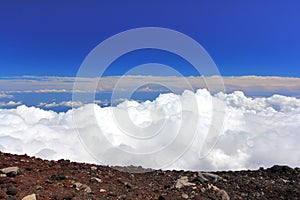 Clouds above mountain high and blue sky