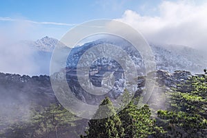 Clouds above the peaks and hotels of Huangshan National park.