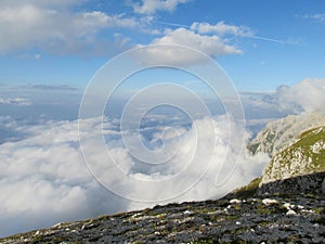 Clouds above rocky peak of Apennine Mountain Range photo