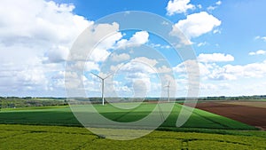 Clouds Above Two Wind Turbines In The Middle Of The Countryside