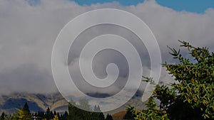 Clouds amassing on hillside