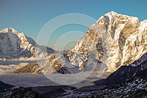 Clouds at the base of Lobuche mountain in Nepal photo