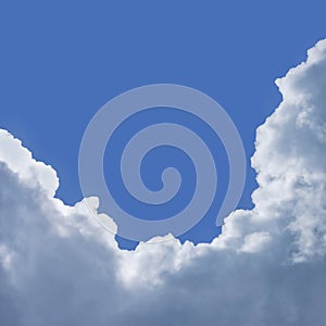 Clouds with a silver lining and blue sky