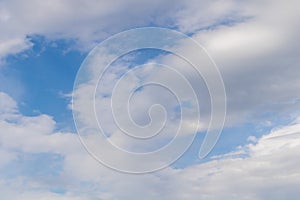 Clouds in the blue sky as a background for multiple applications