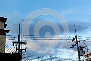 Clouds on a blue sky electric pole