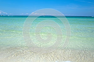 Clouds with blue sky over calm sea beach in tropical beach. Banner or wallpaper for blue sea design, Ocean texture or