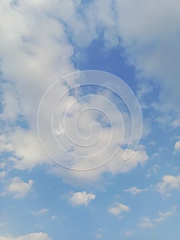 Clouds in the blue sky. Summer blue sky cloud gradient light white background. Image of beautiful blue sky.