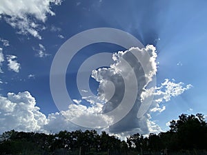 Clouds, Blue Sky and Sun Rays on a Sunny Day