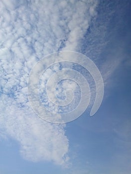 Clouds in the blue sky on a sunny summer day