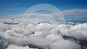 Clouds with blue sky view from airplane window