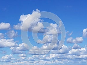 Clouds in a bright blue sky on a sunny day