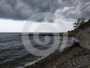 The clouds, cataclysm, coast over the Black sea beach