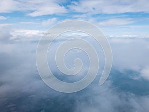 Clouds and clear bright blue sky. Aerial view from plane illuminator