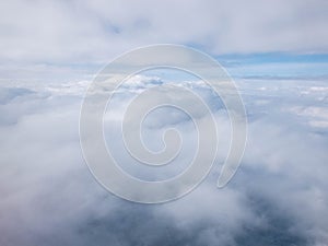 Clouds and clear bright blue sky. Aerial view from plane illuminator