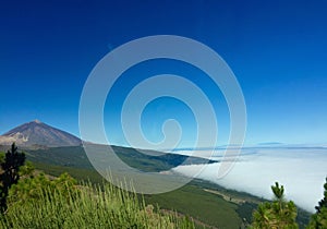 The clouds climb the mountain trying to climb the Teide.