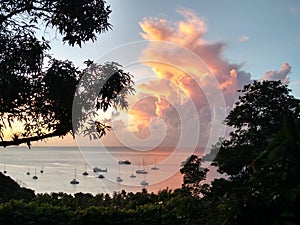 Clouds colored by the setting sun in the windward islands