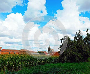 clouds and conrfields in a village in Spain