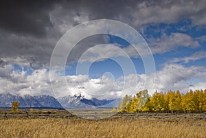 Clouds coving the sky above the Teton Mountain Range in the Fall