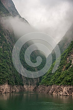 Clouds descending along green slopes, Wu Gorge, Guandukou, China