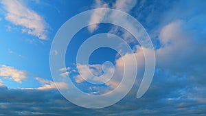 Clouds in different shades. Clouds during sunset. Panoramic view. Timelapse.