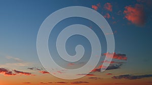 Clouds in different shades. Clouds during sunset. Panoramic view. Timelapse.