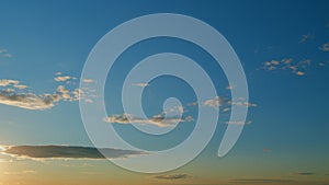 Clouds in different shades. Clouds during sunset. Panoramic view. Timelapse.