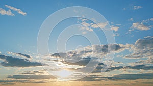 Clouds in different shades. Clouds during sunset. Panoramic view. Timelapse.